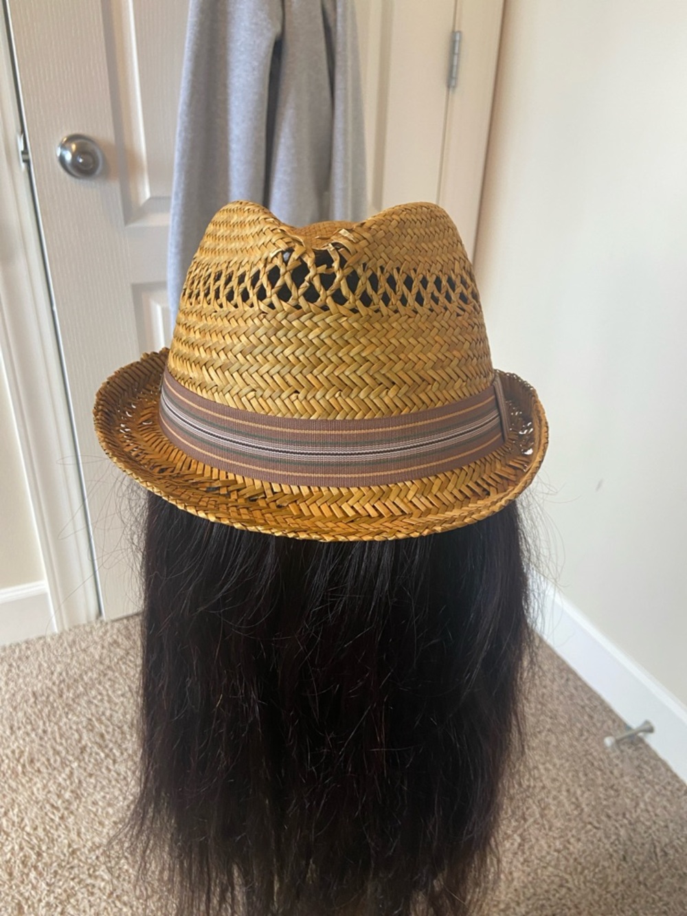 Straw Hat with a Striped Ribbon